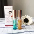 CLARINS ECLAT MINUTE DUO HUILE CONFORT LEVRES LIP COMFORT OIL DUO 06&07 2*2.8 ML.