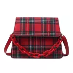 The New Retro Checered Bag Is A One-Oulder Handbag With A Red White And Blue Gluig Stic Bag Under The Armpits