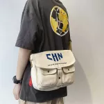 กระเป๋า กระเป๋าสะพายข้างผู้ชายแบรนด์อินเทรนด์กระเป๋าผ้าแคนวาสญี่ปุ่น men’s casual shoulder bag student large-capac