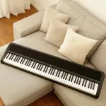 Korg® B2SP Piano Fah Piano Digital 88 Key Steer Speaker Key Steer has a USB connector in a black computer + with a stand and pedal.