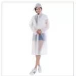 A woman who is not used and throws a large white rain shirt