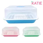 Katie K, which is upside down, 12 -spoke bottle that is upside down with pastel colored lids.