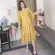 Yellow maternity clothes open to feed